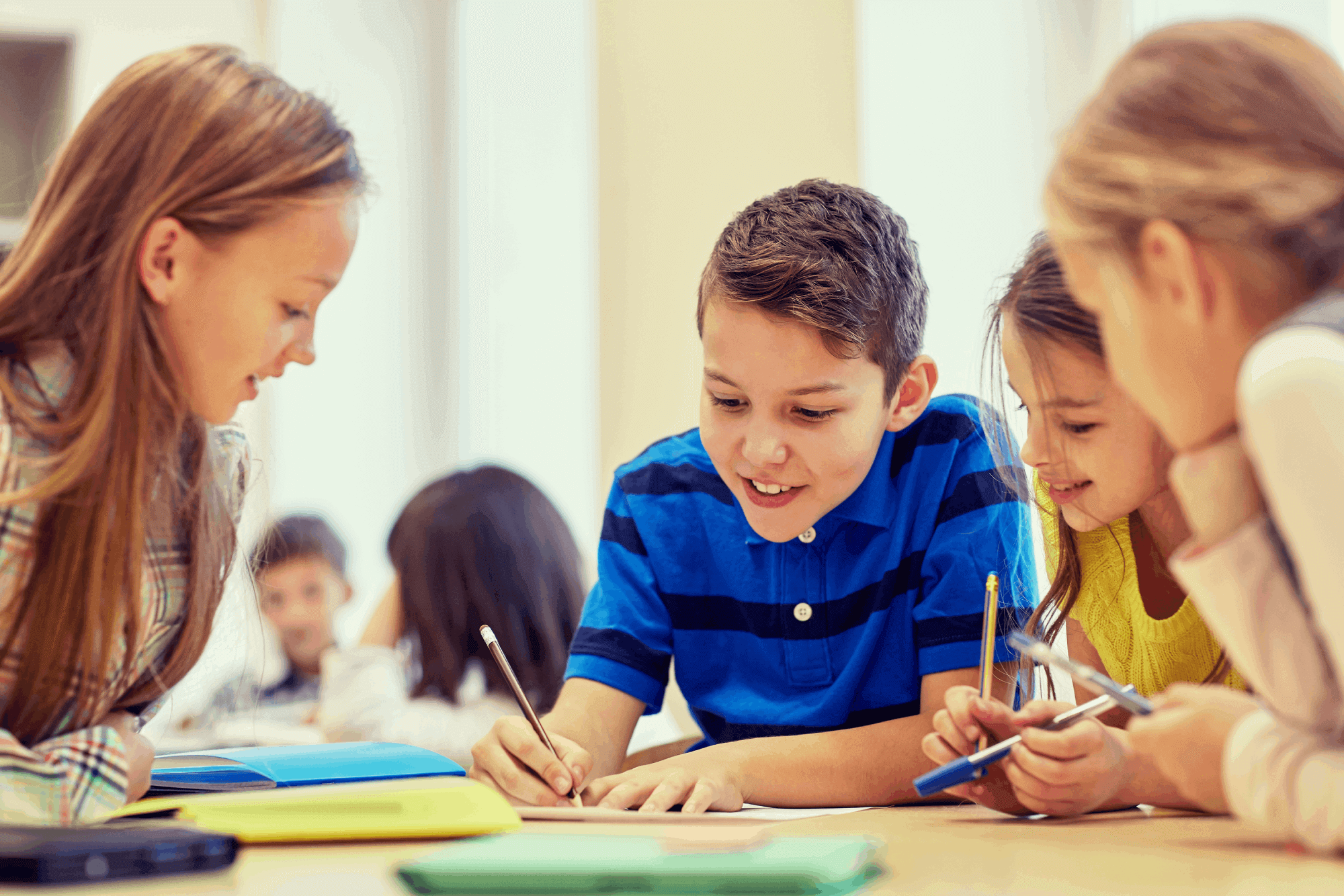 A group of young kids learn at school