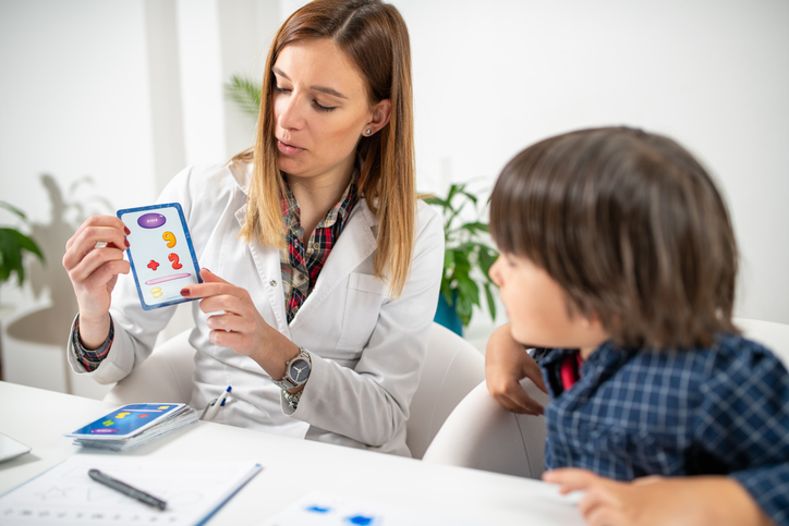 Early mental acuity as a toddler engages in a captivating logic test with numbered cards, fostering emotional intelligence
